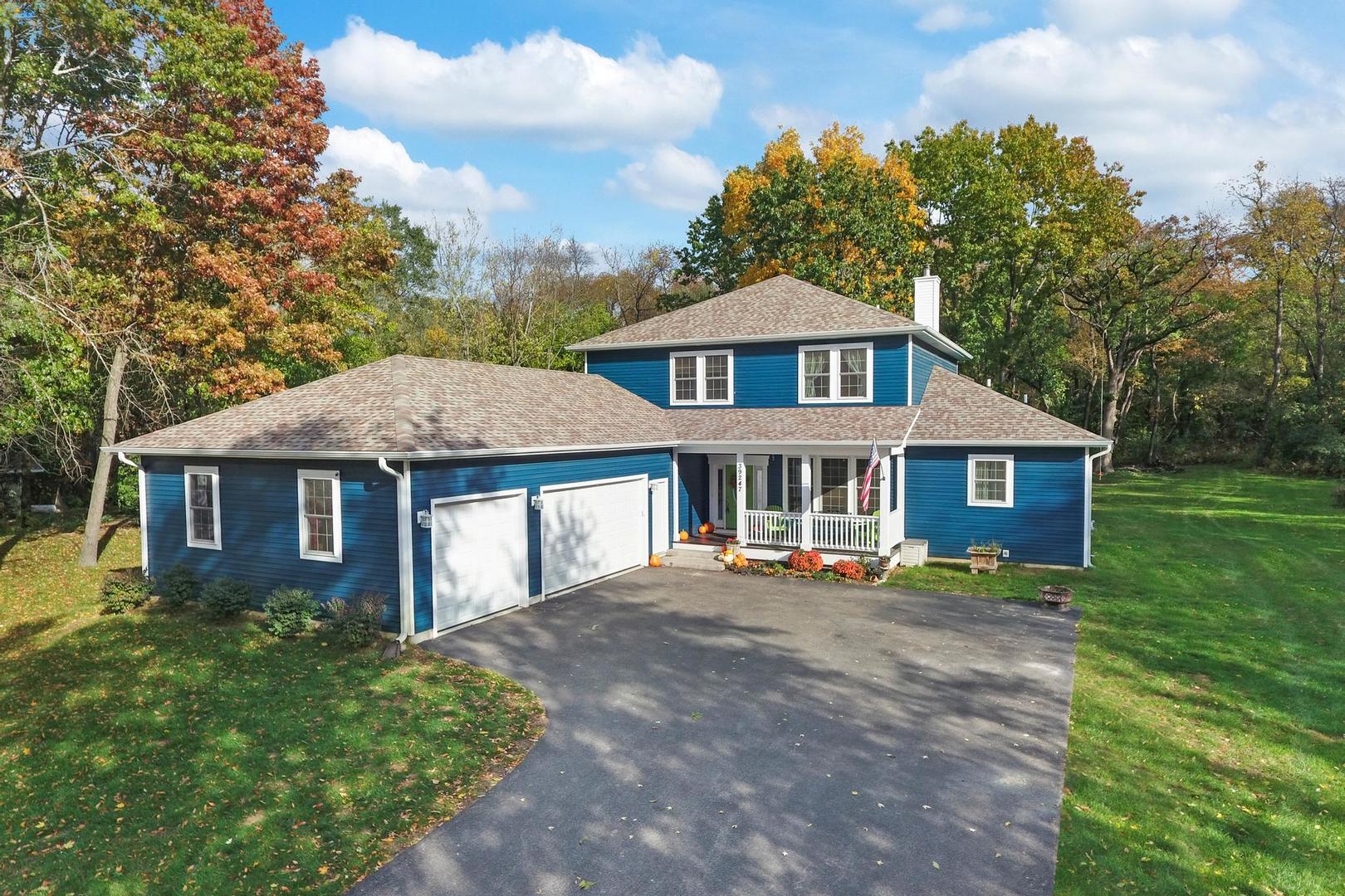 39247 Rangers Way Antioch, IL 60002 - Photo 2 of 33 a front view of a house with a yard