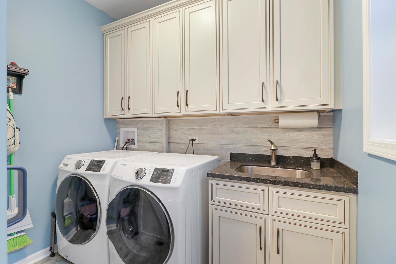 39247 Rangers Way Antioch, IL 60002 - Photo 22 of 33 a view of washer and dryer with kitchen countertops