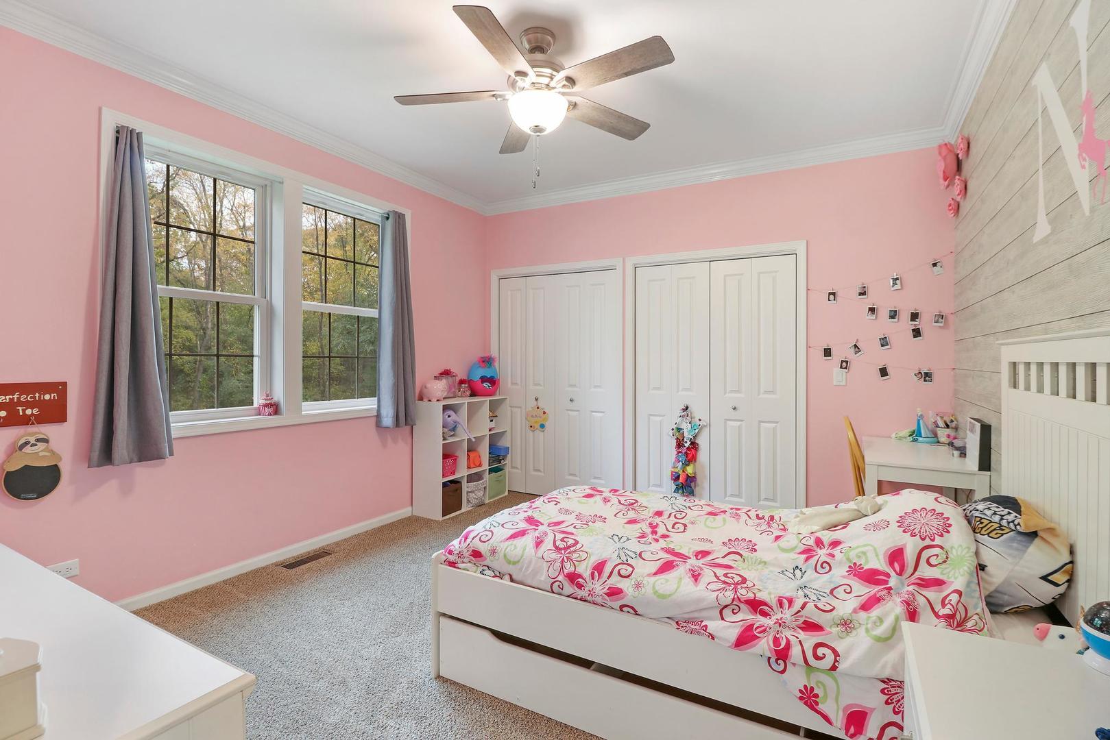 39247 Rangers Way Antioch, IL 60002 - Photo 24 of 33 a bedroom with a bed dresser and a window
