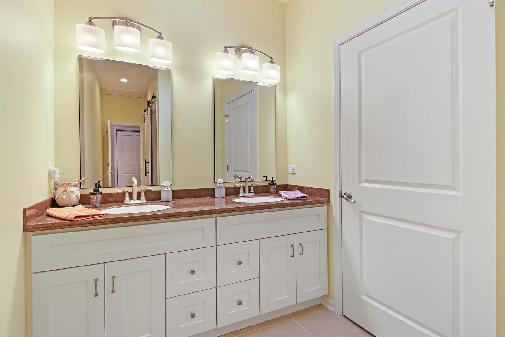 39247 Rangers Way Antioch, IL 60002 - Photo 27 of 33 a bathroom with a double vanity sink and a mirror