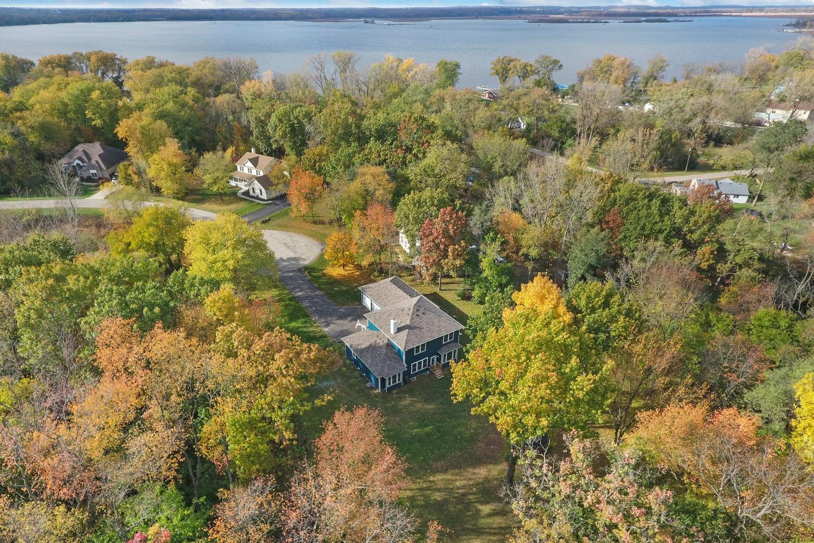 39247 Rangers Way Antioch, IL 60002 - Photo 4 of 33 a view of a lake with a building in the background
