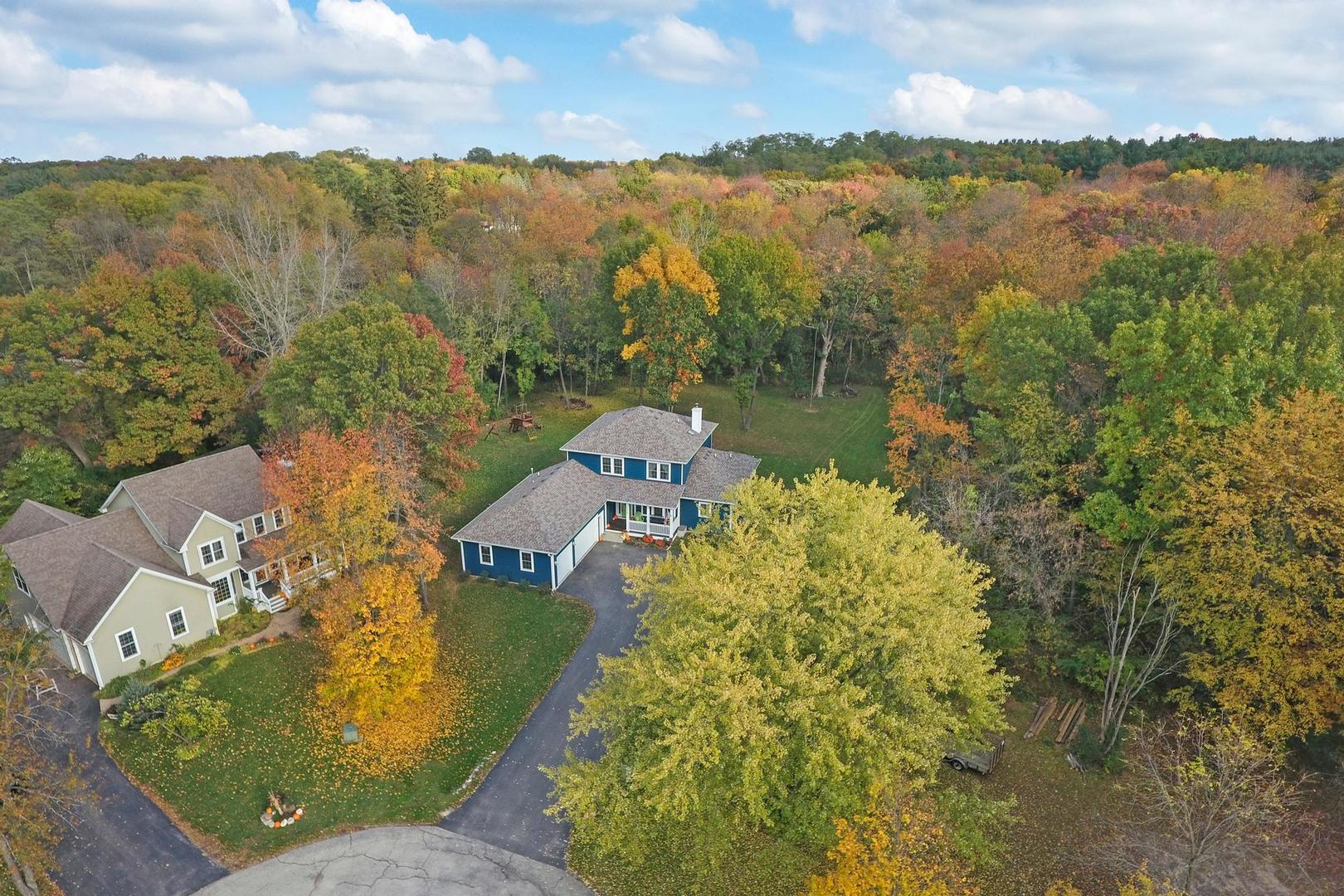 39247 Rangers Way Antioch, IL 60002 - Photo 5 of 33 a view of a lake with a mountain in the background