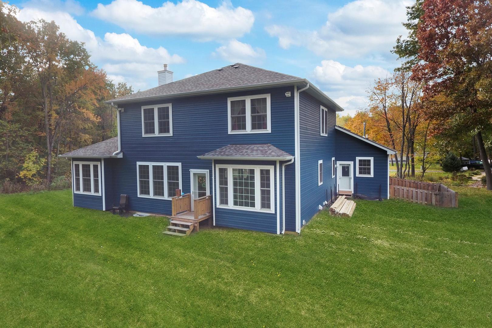 39247 Rangers Way Antioch, IL 60002 - Photo 7 of 33 a view of a house with a yard