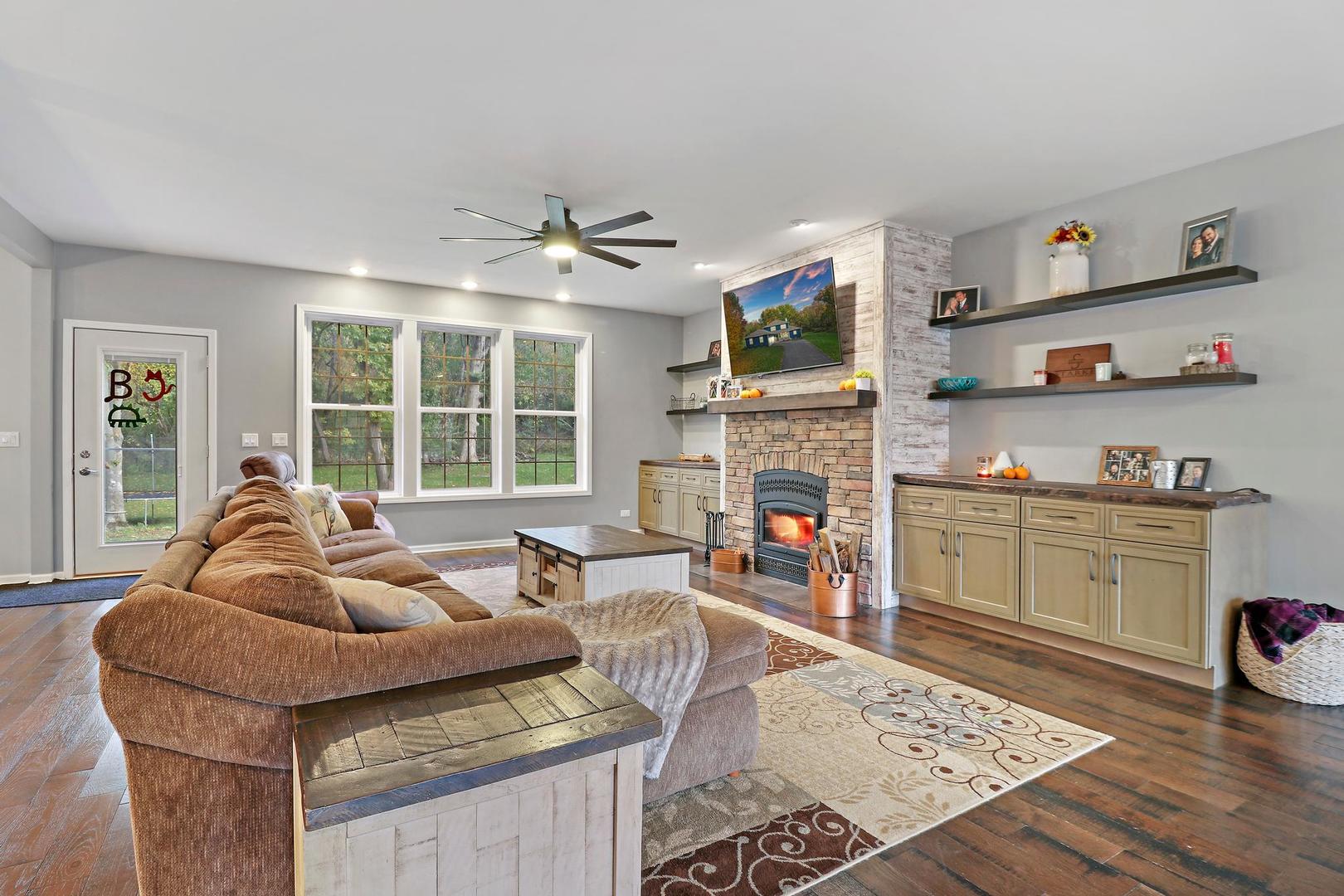 39247 Rangers Way Antioch, IL 60002 - Photo 10 of 33 a living room with furniture and a fireplace