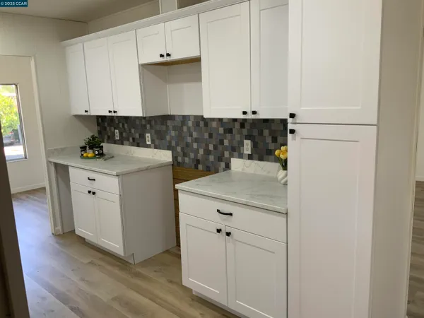 a kitchen with a sink and cabinets