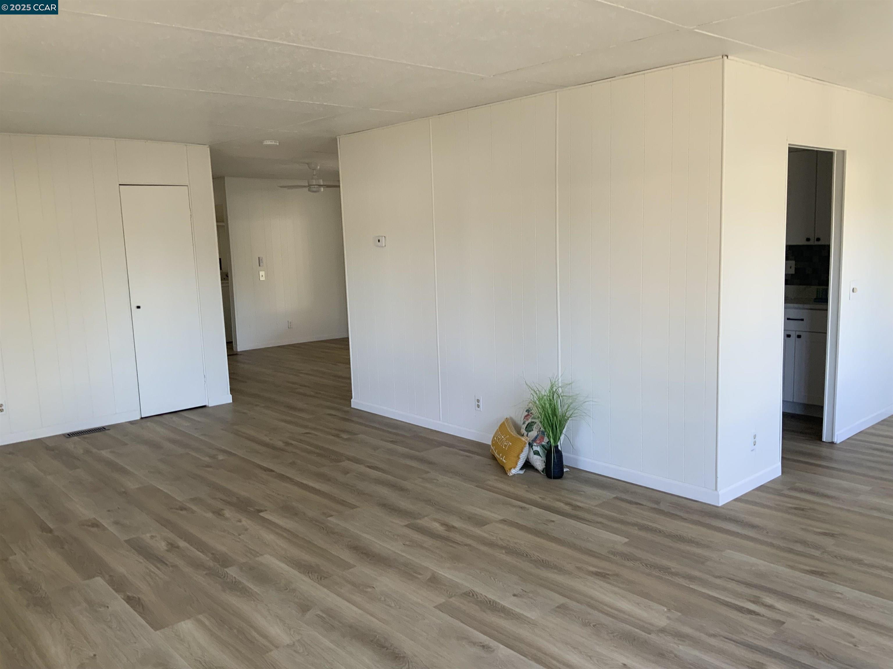 165 Tiki Lane Pittsburg, CA 94565 - Photo 24 of 28 a view of empty room with wooden floor