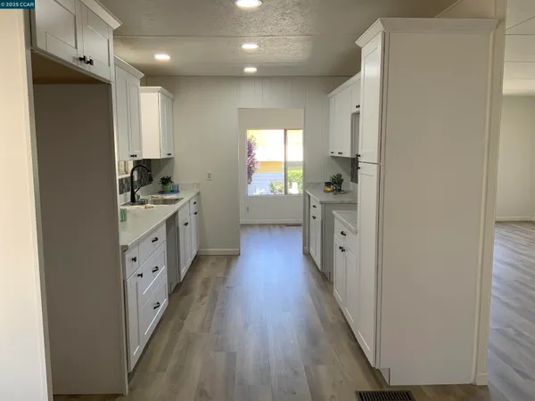 a bath room with a bath tub and a sink