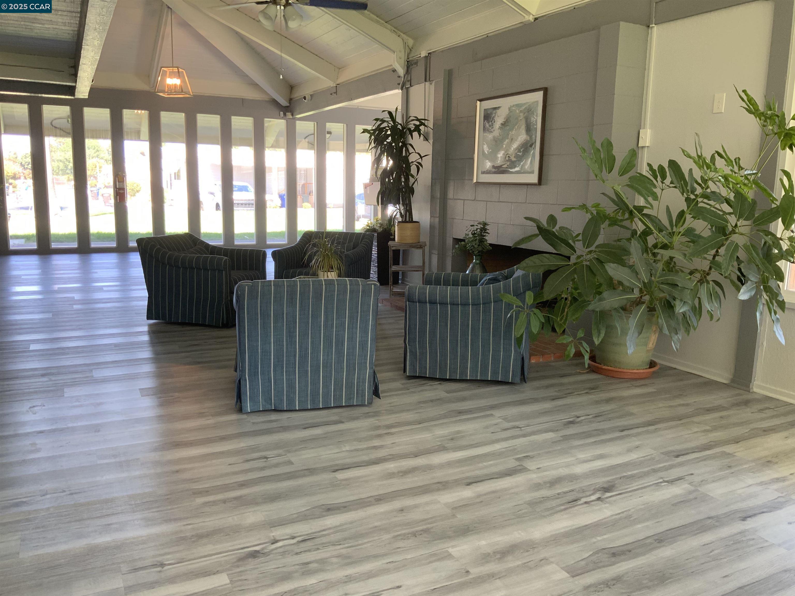 165 Tiki Lane Pittsburg, CA 94565 - Photo 3 of 28 a living room with furniture and a potted plant