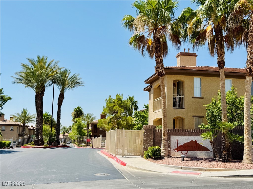 10231 Deerfield Beach Avenue, Unit 103 Las Vegas, NV 89129 - Photo 31 of 31 View of asphalt street with curbs, sidewalks, and a gate