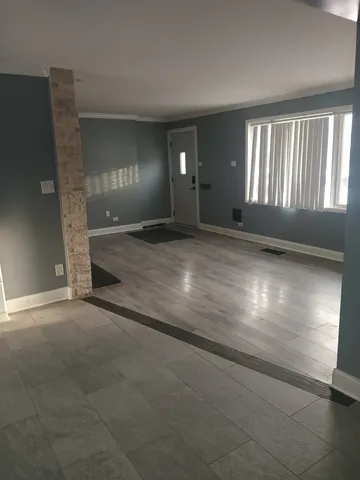 a view of an empty room and window