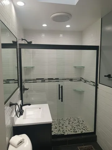a bathroom with a sink and a mirror