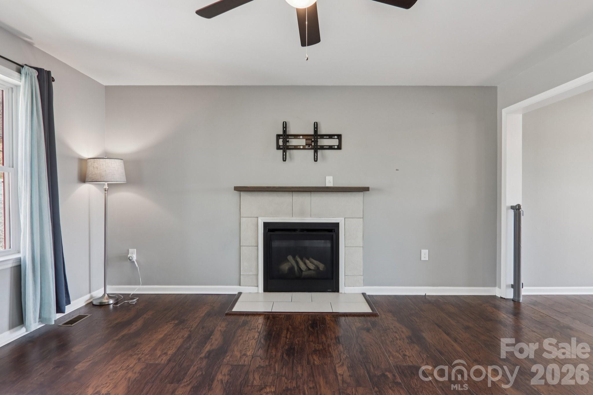 751 Hutch Mountain Road Fletcher, NC 28732 - Photo 10 of 48 a living room with a fireplace