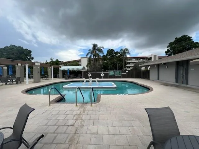 a view of a swimming pool with a patio