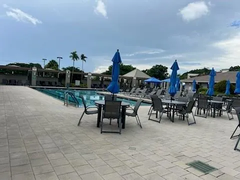 a view of a tables and chairs in patio