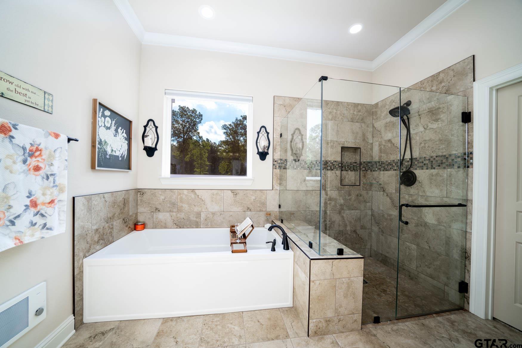 343 Driskell Bridge Road Harleton, TX 75651 - Photo 17 of 42 a bathroom with a tub sink and mirror