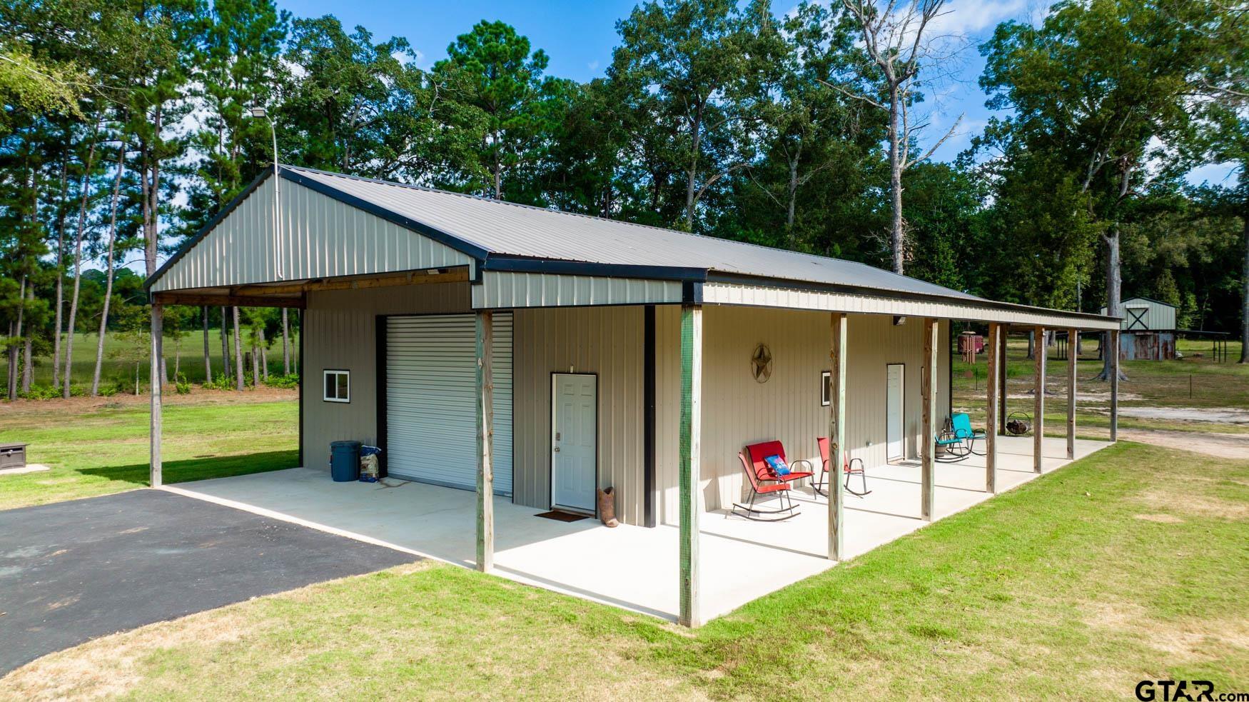 343 Driskell Bridge Road Harleton, TX 75651 - Photo 30 of 42 a view of a house with a backyard