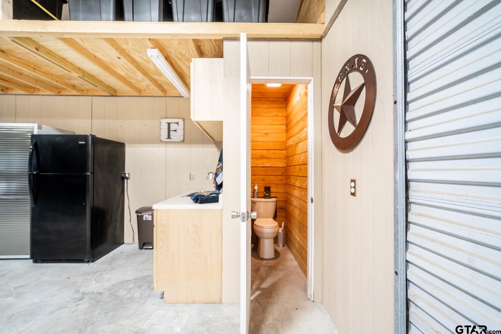 343 Driskell Bridge Road Harleton, TX 75651 - Photo 33 of 42 a utility room with dryer and washer