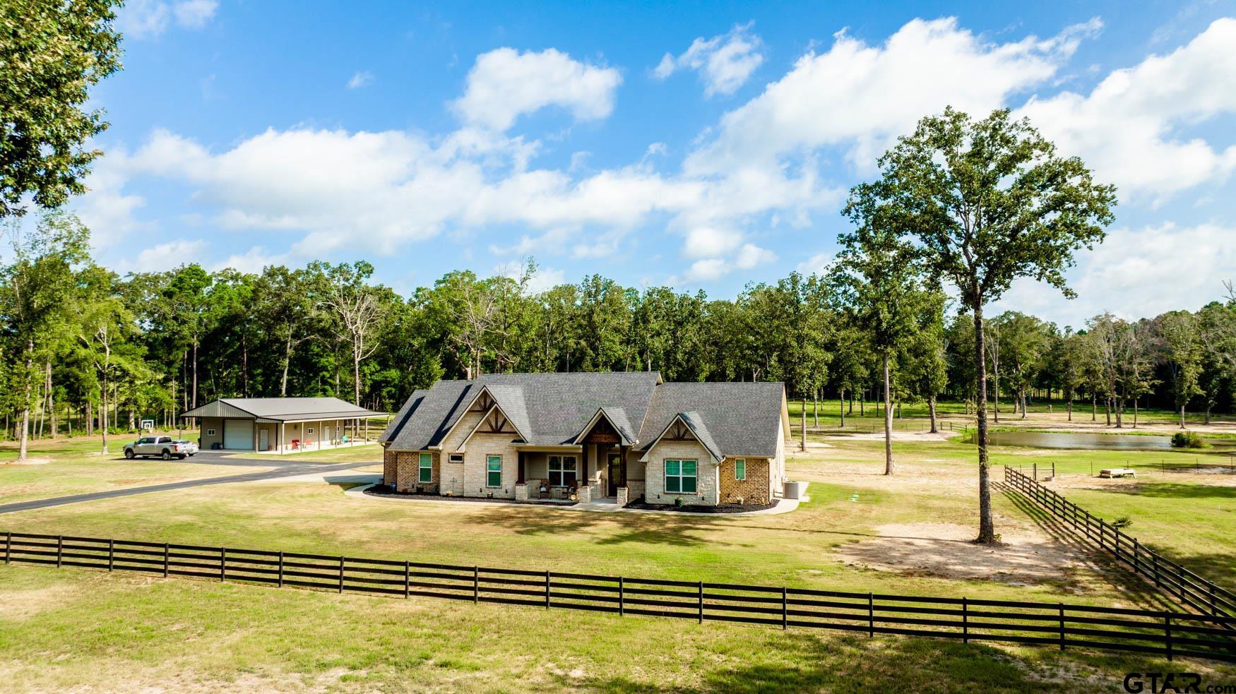 343 Driskell Bridge Road Harleton, TX 75651 - Photo 41 of 42 swimming pool view with lake view