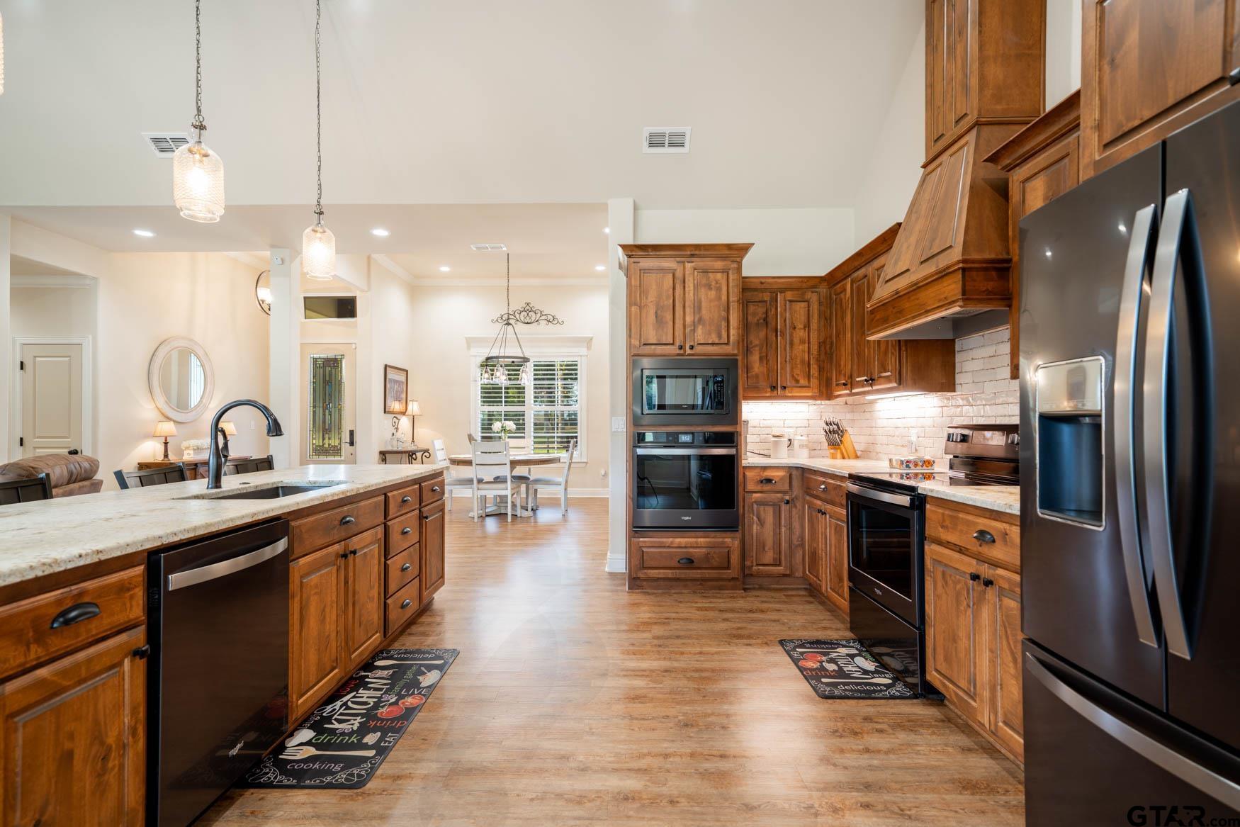 343 Driskell Bridge Road Harleton, TX 75651 - Photo 7 of 42 a kitchen with stainless steel appliances a sink stove and refrigerator