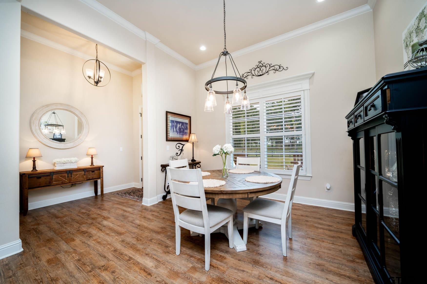 343 Driskell Bridge Road Harleton, TX 75651 - Photo 9 of 42 a view of a dining room with furniture window and wooden floor