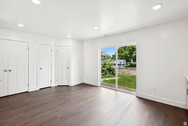 1615 North Angel Street West Layton, UT 84041 - Photo 6 of 22 Unfurnished bedroom featuring two closets, access to exterior, dark wood finished floors, and recessed lighting
