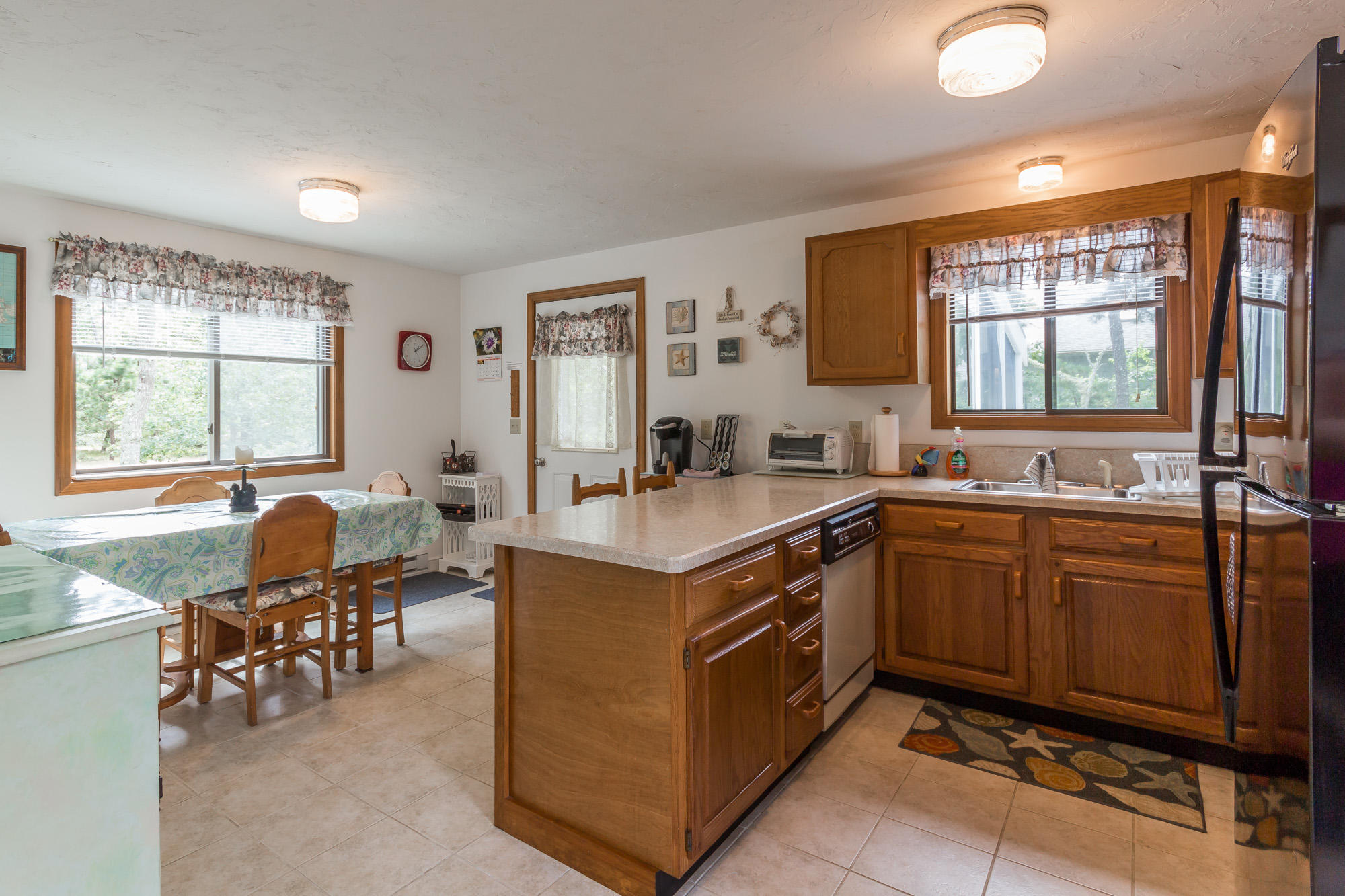 14 Zoll Road Edgartown, MA 02539 - Photo 5 of 20 a kitchen with granite countertop a sink stove and cabinets
