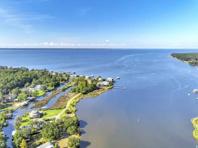a view of a swimming pool with a yard