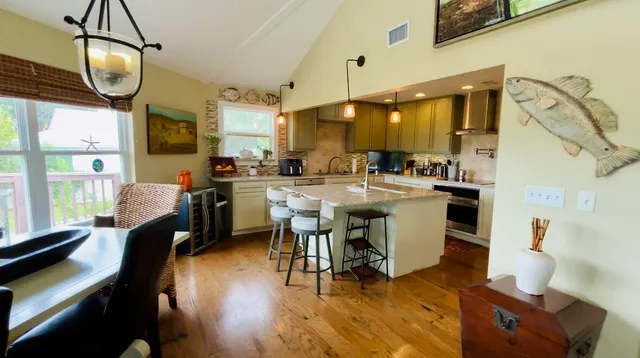 a view of a dining room with furniture window and wooden floor