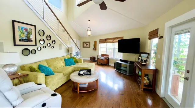 a living room with furniture and a flat screen tv