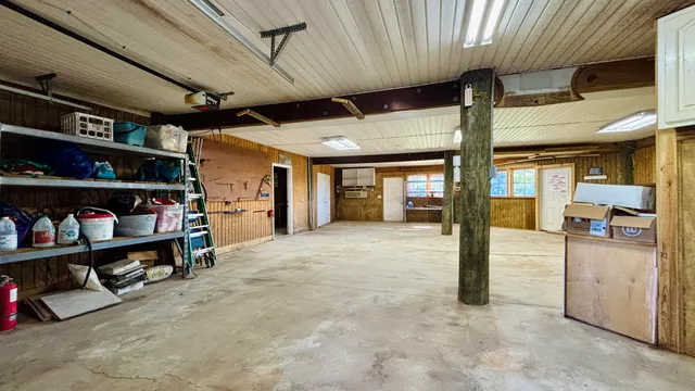 an aerial view of a house a yard and a fountain