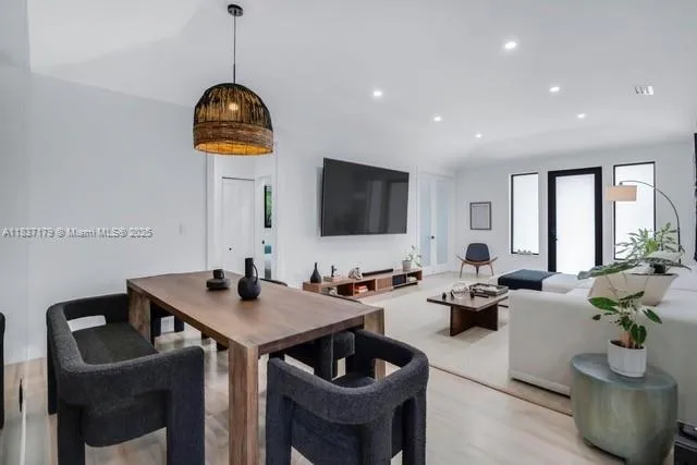 a living room with couches and a flat screen tv