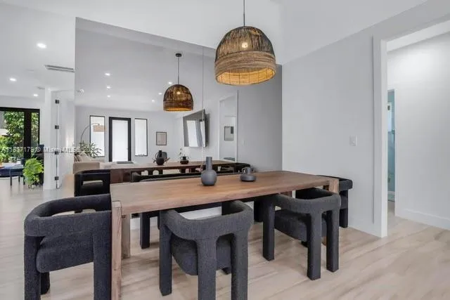 a view of a dining room and chairs