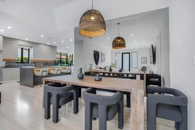 a kitchen with a table and chairs in it