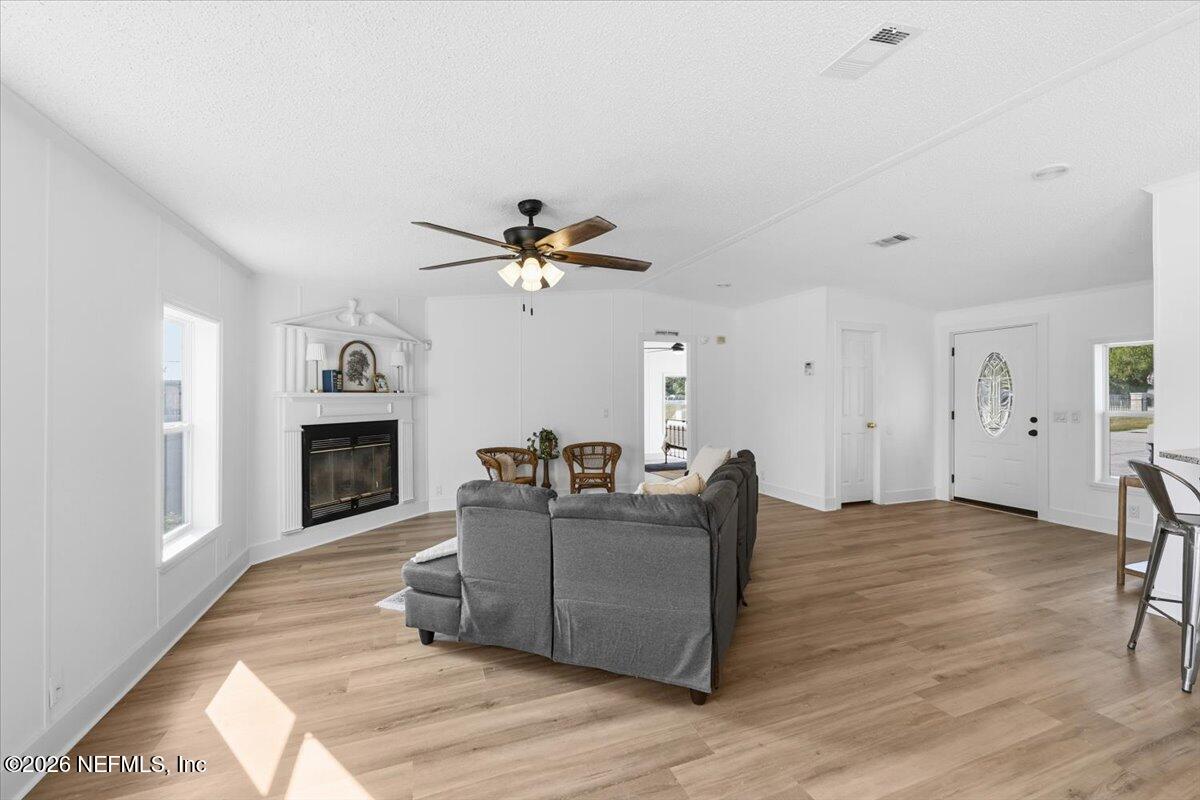 345 Jones Road Jacksonville, FL 32220 - Photo 13 of 32 a living room with furniture and a fireplace