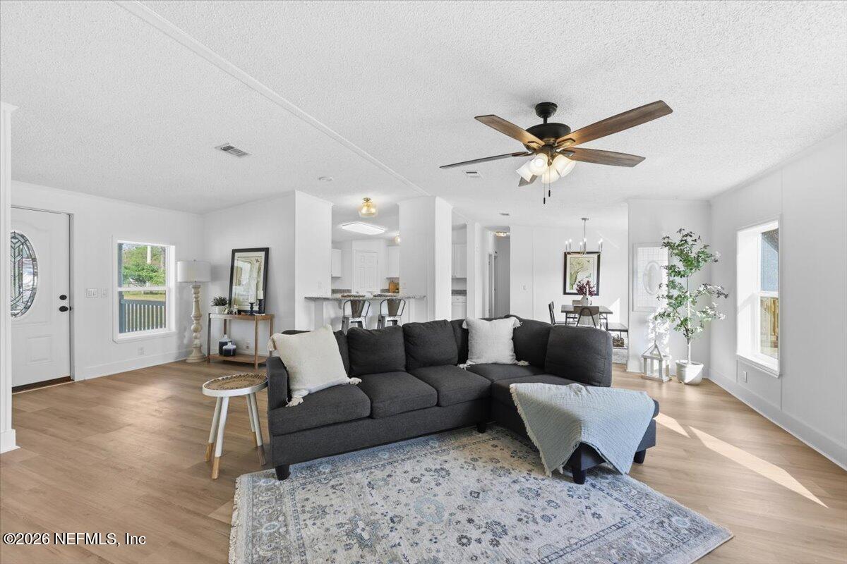 345 Jones Road Jacksonville, FL 32220 - Photo 14 of 32 a living room with furniture and a rug