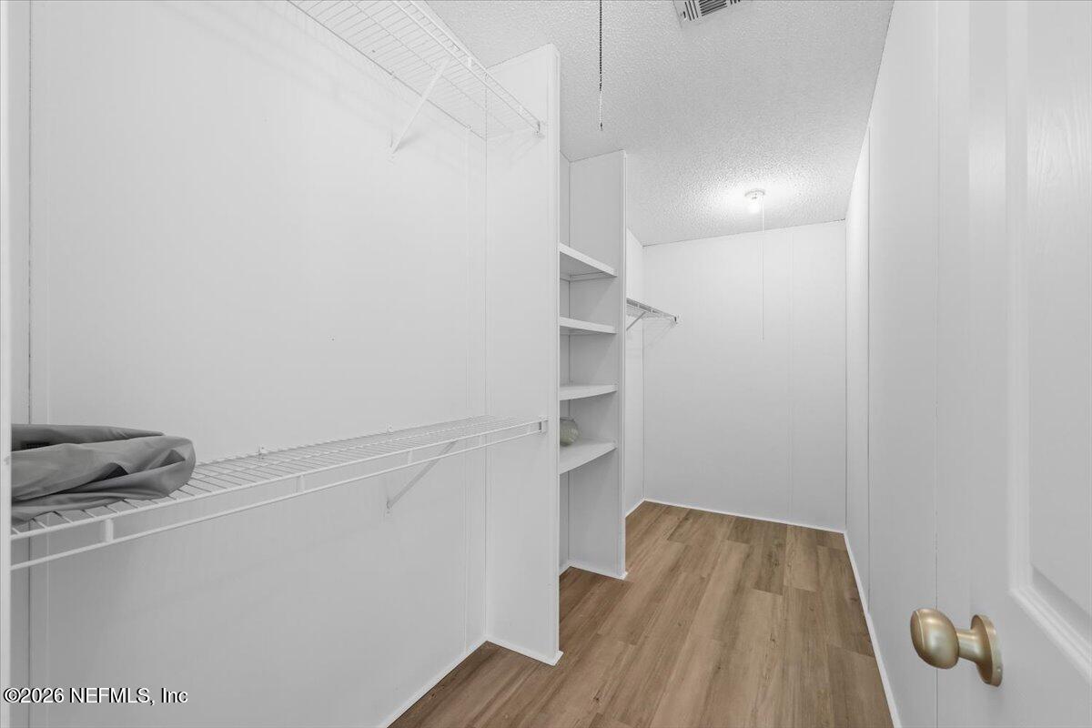 345 Jones Road Jacksonville, FL 32220 - Photo 21 of 32 a view of storage and utility room with racks on the wall