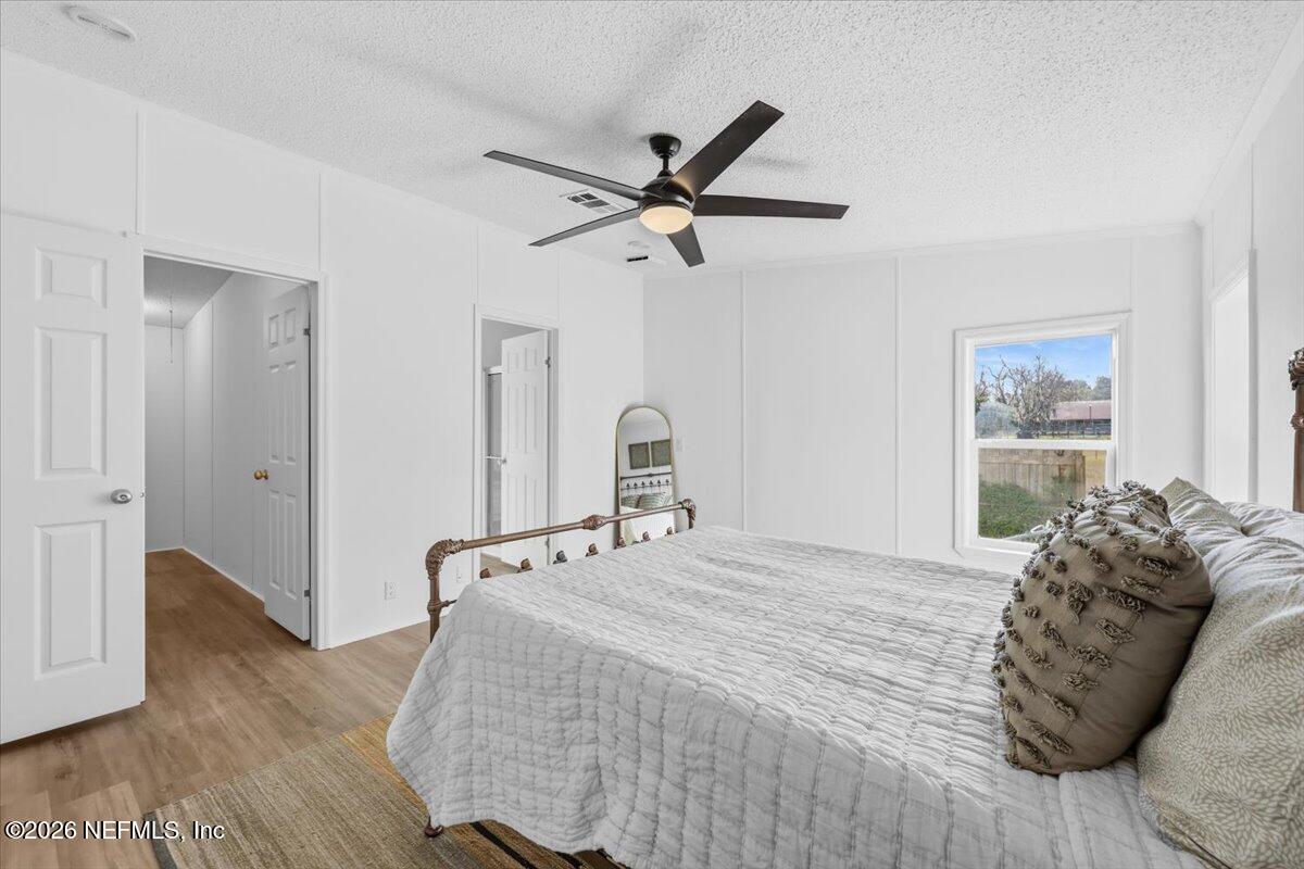 345 Jones Road Jacksonville, FL 32220 - Photo 23 of 32 a bedroom with a bed and a window