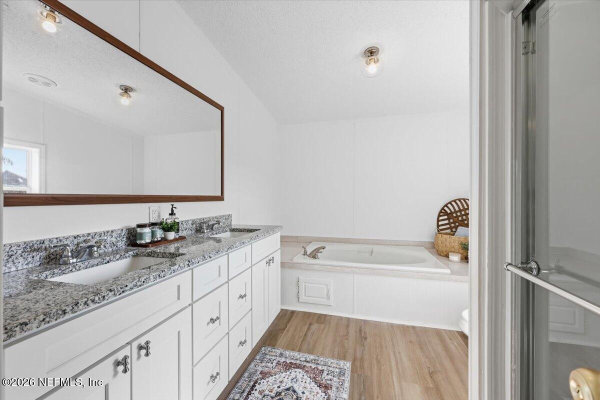 345 Jones Road Jacksonville, FL 32220 - Photo 24 of 32 a bathroom with a sink a toilet and mirror