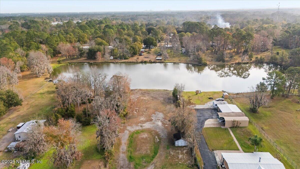 345 Jones Road Jacksonville, FL 32220 - Photo 3 of 32 an aerial view of residential houses with outdoor space and lake view