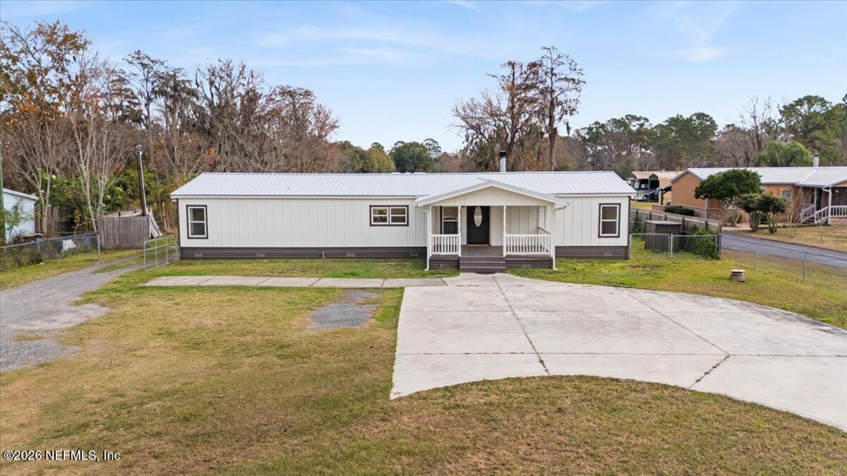 345 Jones Road Jacksonville, FL 32220 - Photo 32 of 32 a view of a house with a backyard
