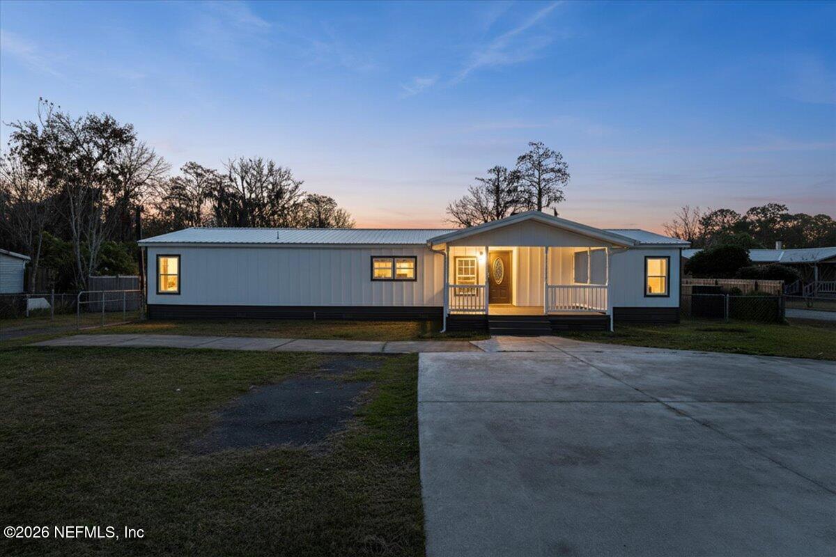 345 Jones Road Jacksonville, FL 32220 - Photo 5 of 32 a front view of a house with a yard