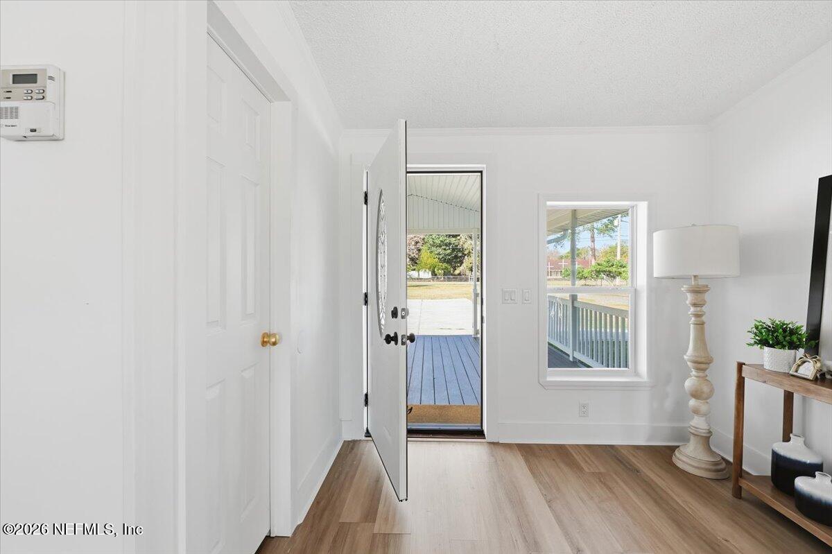 345 Jones Road Jacksonville, FL 32220 - Photo 9 of 32 a view of livingroom with hardwood floor and window