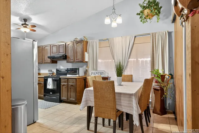 a view of a dining room with furniture window and outside view