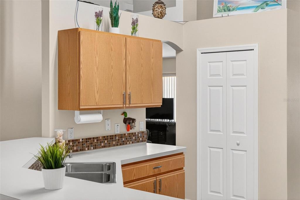3859 Southwest 109th Lane Ocala, FL 34476 - Photo 14 of 55 a kitchen with a white cabinets and white appliances