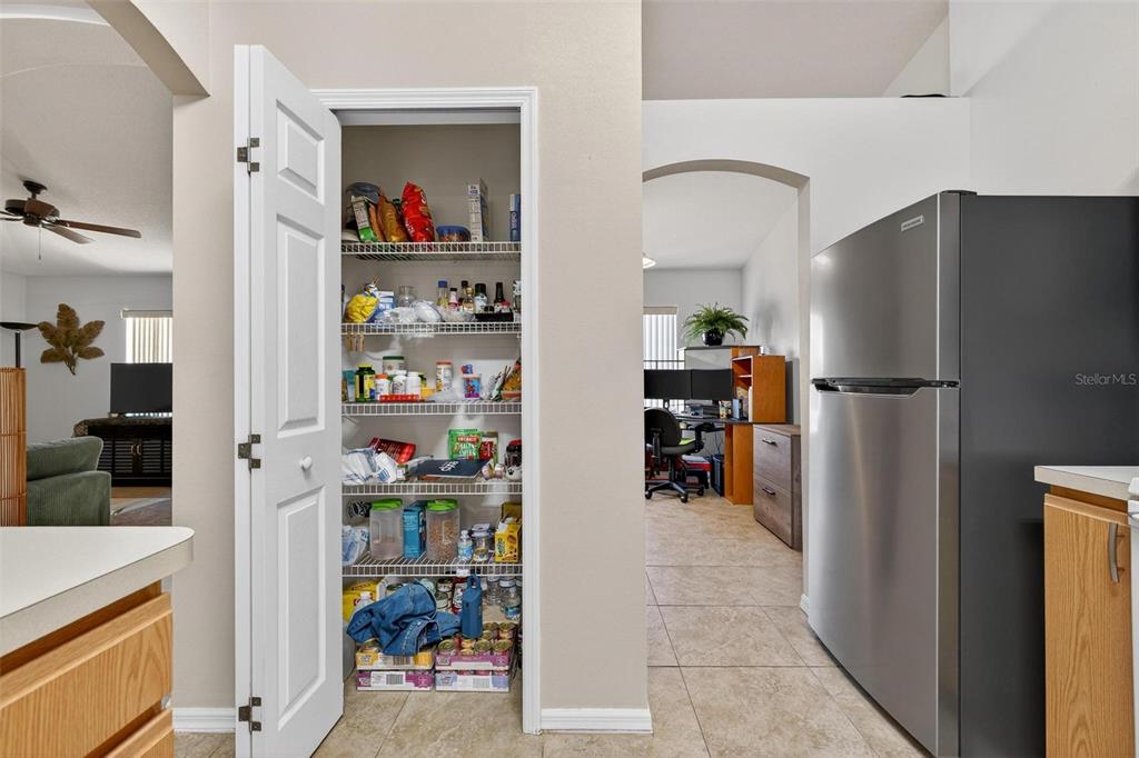 3859 Southwest 109th Lane Ocala, FL 34476 - Photo 15 of 55 a kitchen with stainless steel appliances refrigerator and a refrigerator