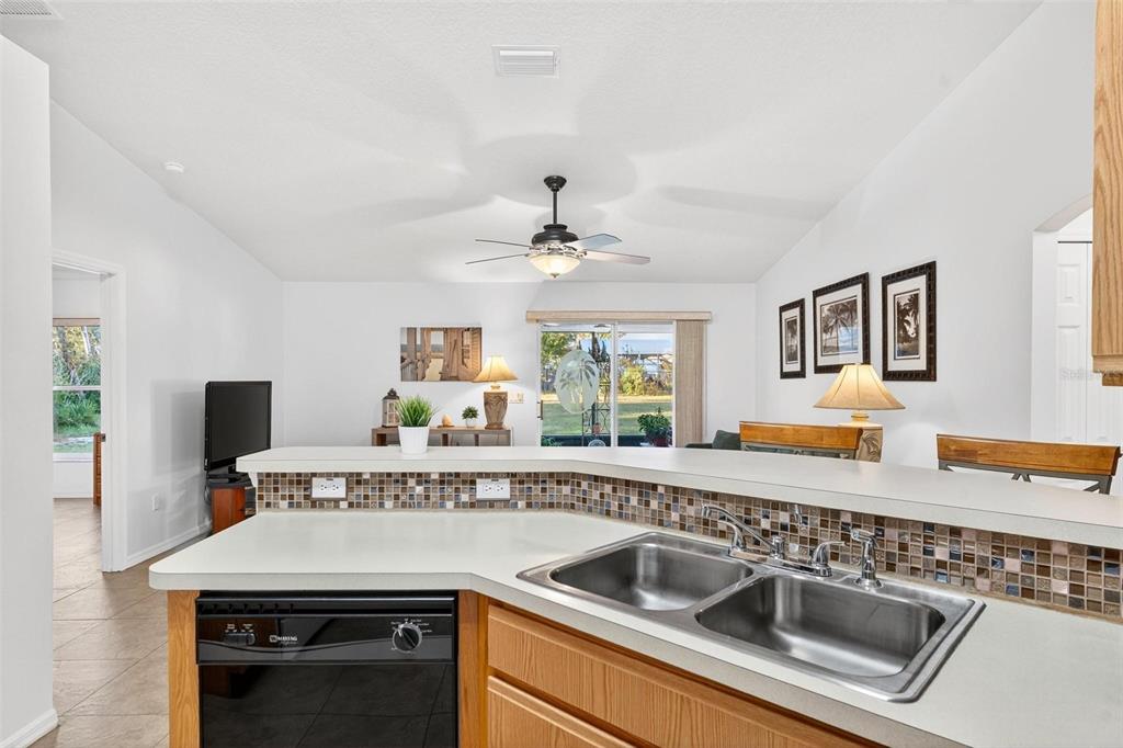 3859 Southwest 109th Lane Ocala, FL 34476 - Photo 16 of 55 a kitchen with a sink and a stove top oven