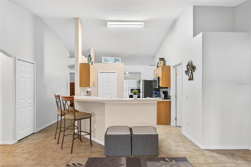 3859 Southwest 109th Lane Ocala, FL 34476 - Photo 20 of 55 a living room with stainless steel appliances furniture a refrigerator and a table