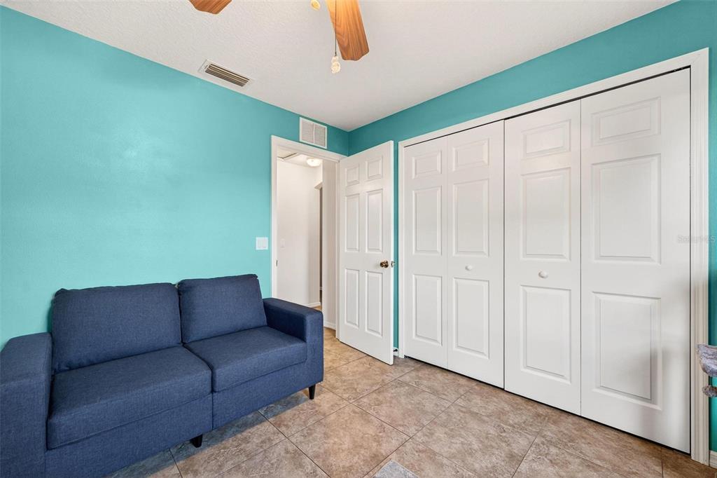 3859 Southwest 109th Lane Ocala, FL 34476 - Photo 32 of 55 a living room with furniture and a ceiling fan