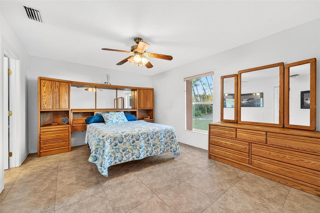 3859 Southwest 109th Lane Ocala, FL 34476 - Photo 35 of 55 a living room with a bed furniture and a large window