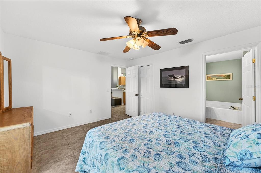 3859 Southwest 109th Lane Ocala, FL 34476 - Photo 36 of 55 a bedroom with a bed and a dresser